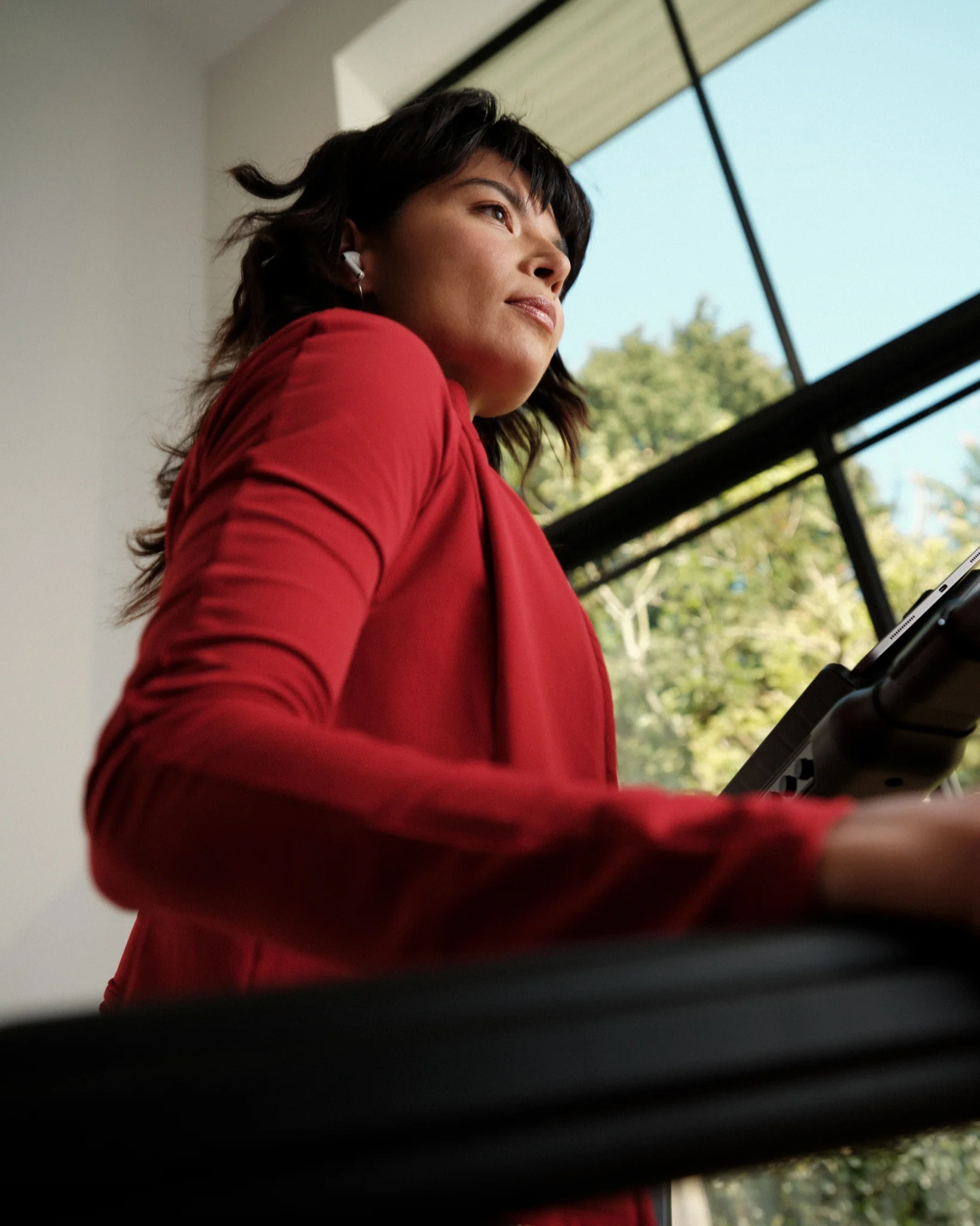 Woman using Moov walking equipment with bold Moov branding in a modern lifestyle campaign visual.